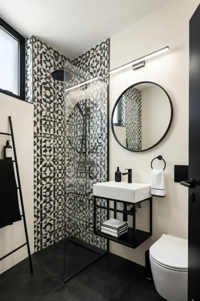 Small bathroom with black and white tiles